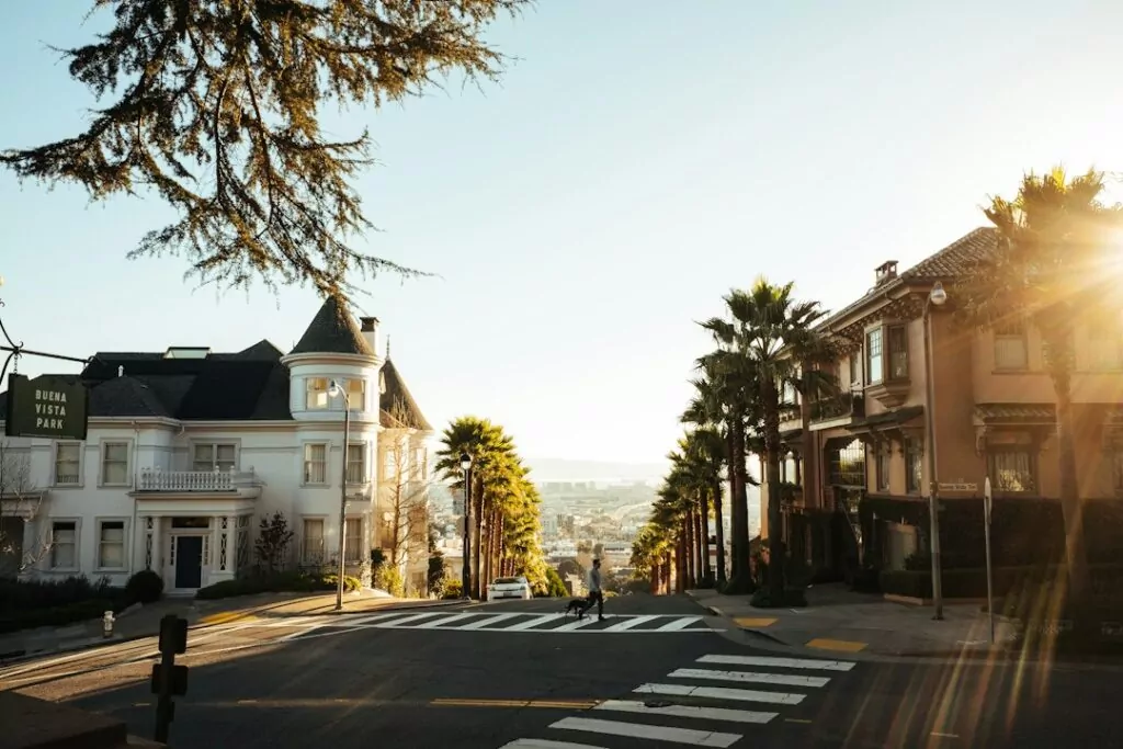 A sunny street in a hilly area near Buena Vista Park, ideal for discreet private investigator surveillance and observation.
